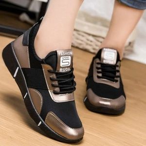 ***SOLD***Woman's gold and black tennis shoes